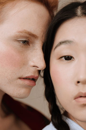 Two women pose in a close-up portrait illustrating skincare for sensitive skin