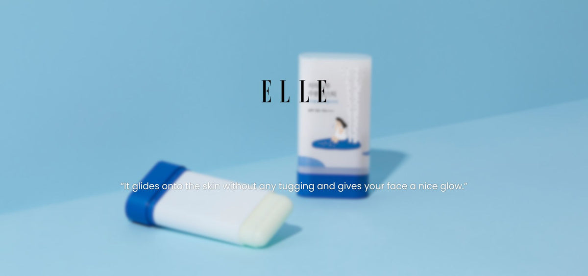 Close-up of ROUND LAB Birch Juice Moisturizing Sun Stick showing two tubes on a blue background with quote about smooth gliding