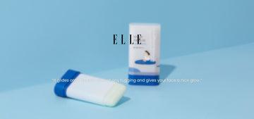 Close-up of ROUND LAB Birch Juice Moisturizing Sun Stick showing two tubes on a blue background with quote about smooth gliding