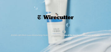 ROUND LAB Birch Juice Moisturizing Cleanser tube on blue background, highlighted by Wirecutter as one of the best facial cleansers
