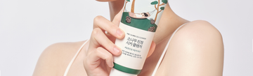 Front view of Pine Calming Cica Cleanser held against a light background