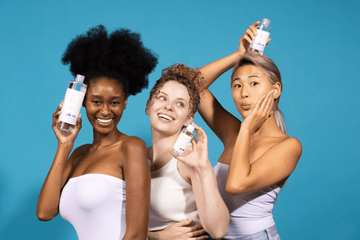 Three diverse women smiling and holding Korean skincare toner bottles against a blue background