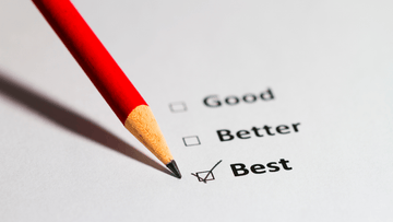 Red pencil marking checklist with options Good, Better, and Best, 'Best' checked