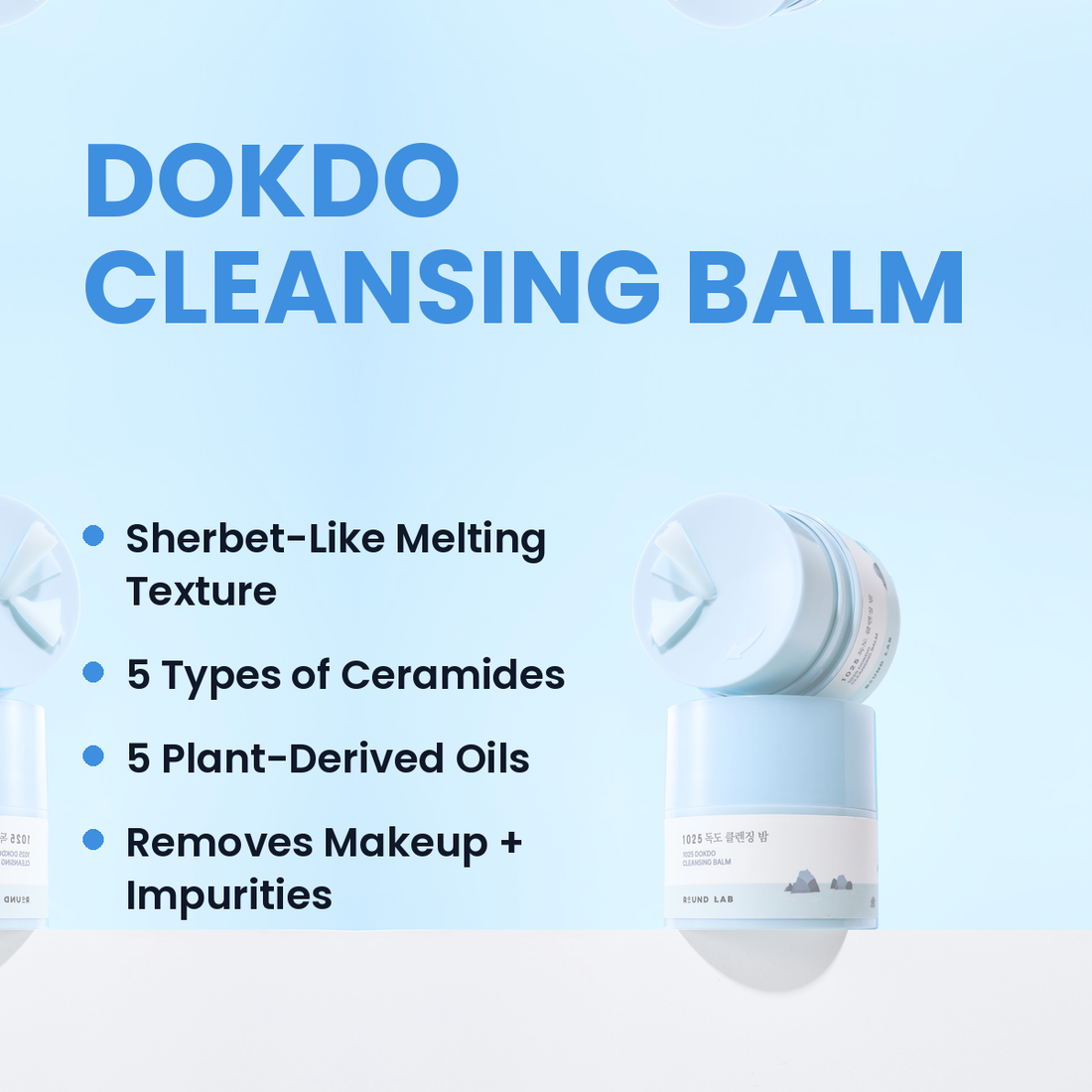 Front view of two 1025 Dokdo Cleansing Balm 50ml jars showcasing blue packaging on a pale blue background