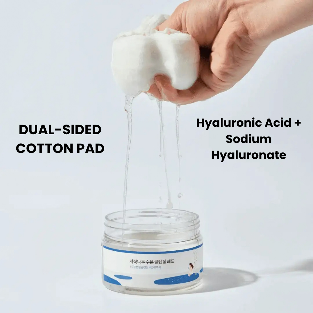 Open jar of Birch Juice Cleansing Pads showcasing round textured pads and a spatula on a blue background