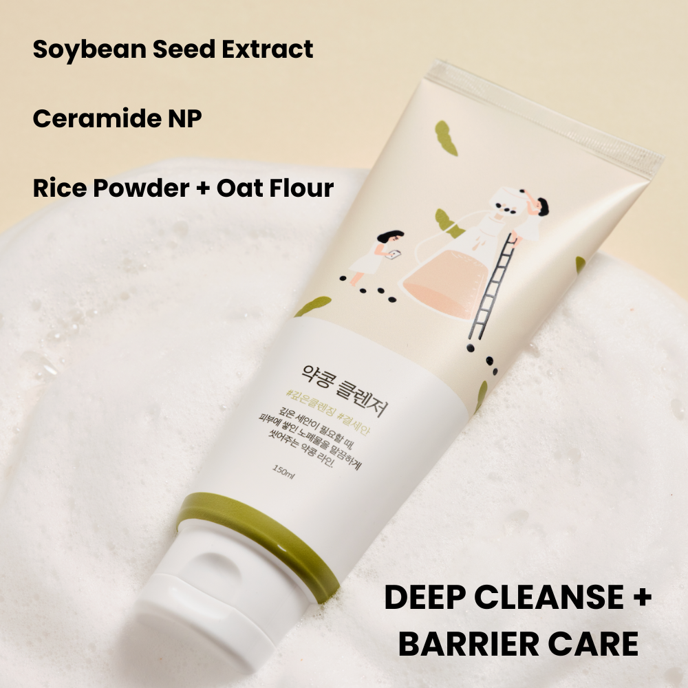 Angled view of Soybean Nourishing Cleanser showcasing its tube, beige cleanser smear, and black soybeans on a beige background