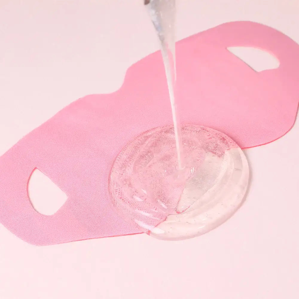 Pack of Camellia Deep Collagen V Lifting Gel Mask on a light pink background
