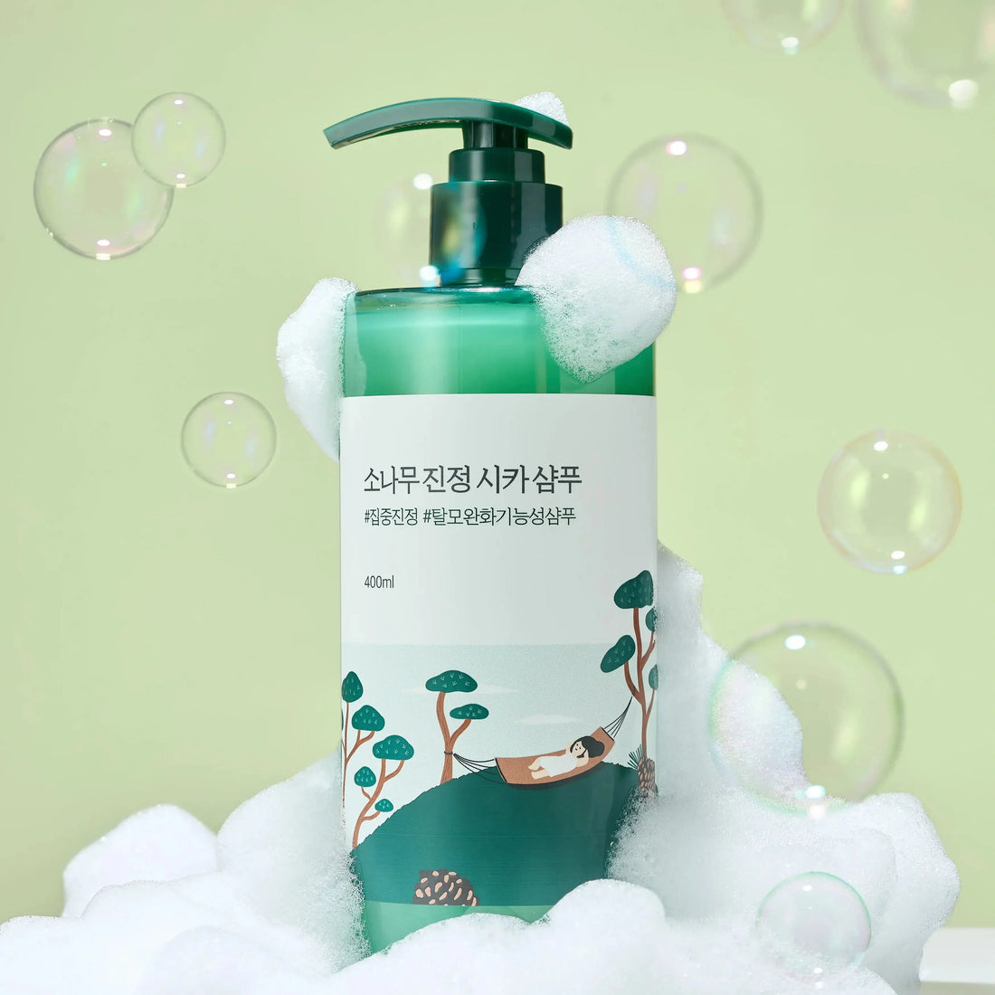 Front view of Pine Calming Cica Body and Scalp Care Bundle with shampoo, scalp tonic, body wash and sheet mask on white pedestal