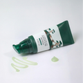Angled view of Pine Calming Cica Primer Sunscreen 50ml showcasing its green cream texture on a white background