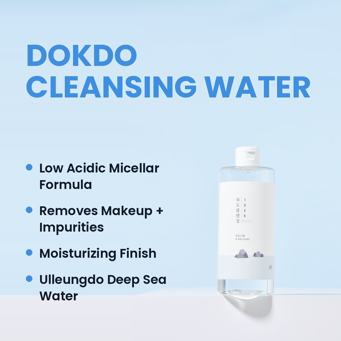 Front view of Dokdo Cleansing Water bottle showcasing its blue formula with a bubbly water background